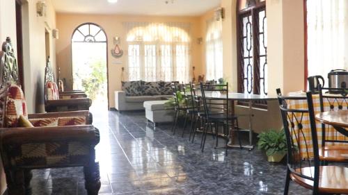 a living room with chairs and a table and a couch at wellassa homestay in Badulla