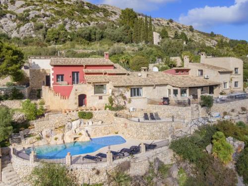 a house on a hill with a swimming pool at SundanceMallorca in Port de Pollensa