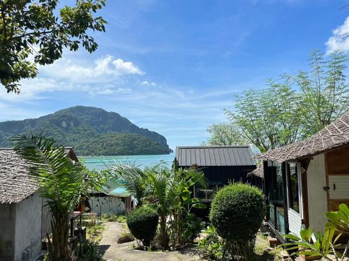 a view of a body of water with a mountain at Phi Phi Goodview Bungalow in Phi Phi Islands