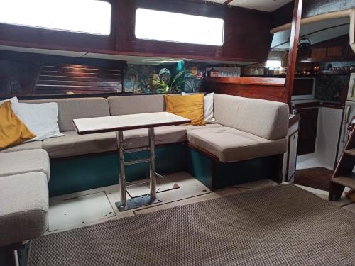 an interior of an rv with a table in it at Voilier-péniche guinguette in Port-Louis