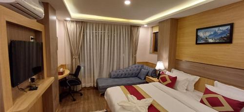 Кровать или кровати в номере Hotel Yakroo Manang