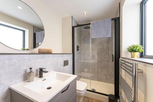 a bathroom with a sink and a shower at Stylish 2 Bedroom Apartments in Derby in Derby