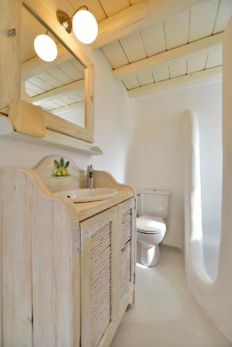 a bathroom with a sink and a toilet at Villa Princess 1 4Bed with Pool Panormos Beach in Mykonos