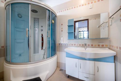 a bathroom with a sink and a shower at S Villa Đà Nẵng Gần Biển in Da Nang