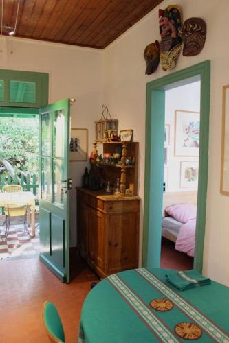 a bedroom with a bed and a door to a room at Le rivage in Biscarrosse-Plage