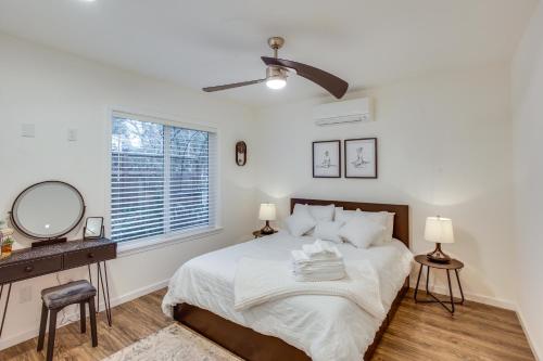 a bedroom with a bed and a dresser and a window at Newly Built Maple Valley Vacation Rental with Patio! in Maple Valley