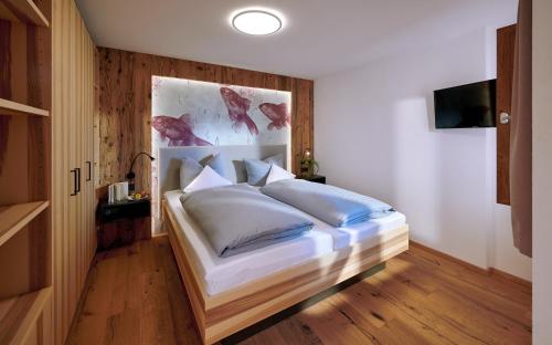 Ein Bett oder Betten in einem Zimmer der Unterkunft Urlaubsbauernhof Kirchmaier