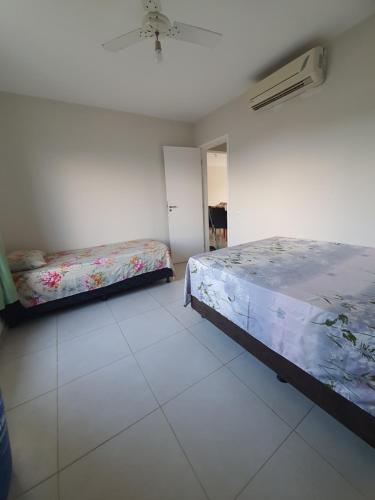 En eller flere senge i et værelse på Apto Térreo - Condomínio Vila das Águas