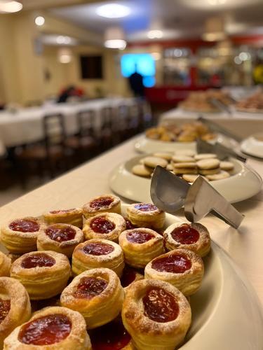 a bunch of pastries sitting on a table at Hotel El Puma in Cusco