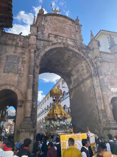 a crowd of people standing in front of a building at Hotel El Puma in Cusco