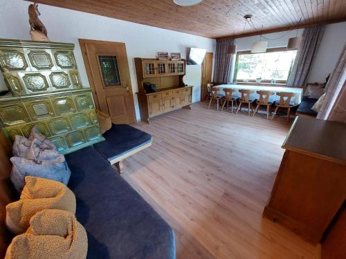 a living room with a couch and a table at Appartements Zellner in Alpbach