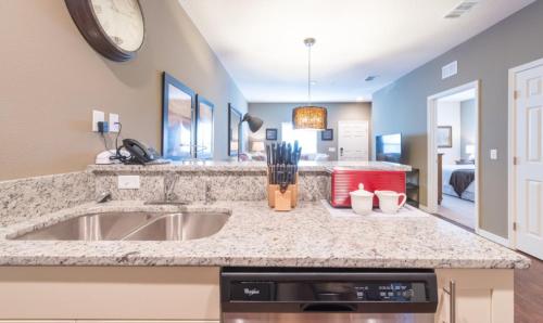 a kitchen with a sink and a counter top at Townhome at West Lucaya Resort 3212 in Orlando