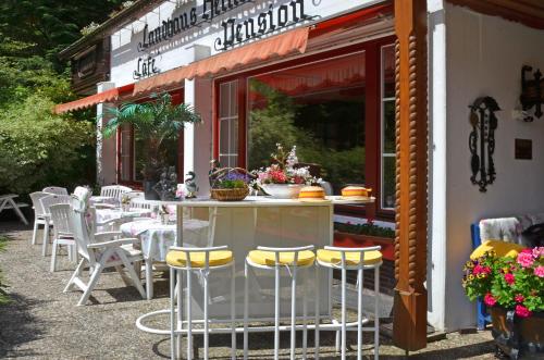 a table and chairs outside of a restaurant at Wellness und Romantik Hotel Helmboldt in Bad Sachsa