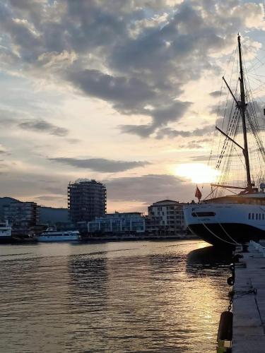 a boat is docked in the water at sunset at Mare Fuori in Portoferraio