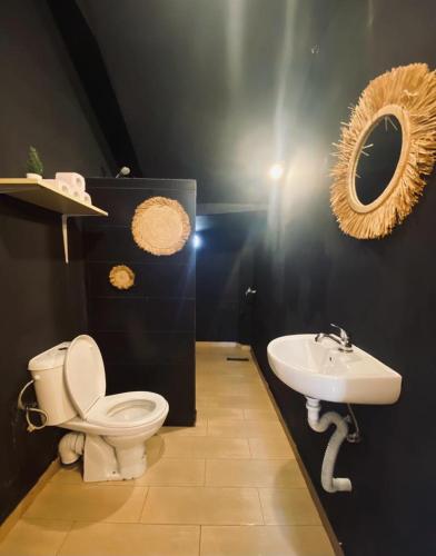 a bathroom with a toilet and a sink at Med tangier apartment -tanger med port 