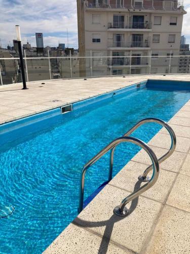 a swimming pool on top of a building at Bolivar San Telmo in Buenos Aires