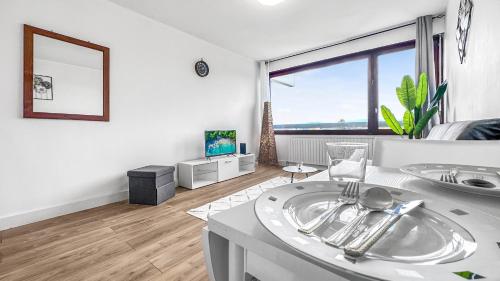 a white room with a sink and a large window at ICE - Proche Gare - Wifi Gratuit - Baignoire in Gaillard