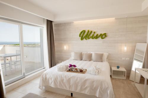 Letto o letti in una camera di San Lorenzo Boutique Hotel & SPA