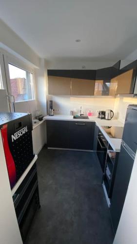 a small kitchen with a sink and a counter at MyHome-Tiny -stilvollen Ruhepol in Lüdinghausen