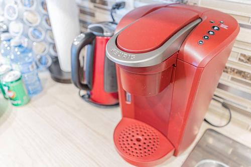 a red coffee maker sitting on a counter at Executive Apartment - 2BDR Parking Self-check in - Walkout basement Lower Unit in Mississauga