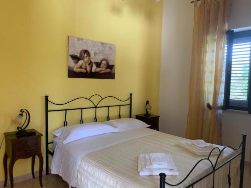 A bed or beds in a room at Perla del Salento