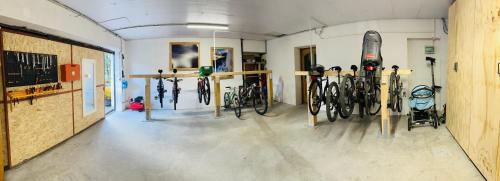 a room with a bunch of bikes parked in it at DOLOMITI HOUSE 4 in Fiera di Primiero