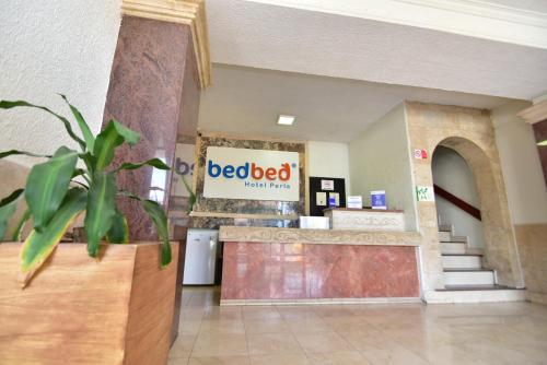 a dead breed sign in a lobby of a hospital at Bed Bed Hotel Perla in Torreón