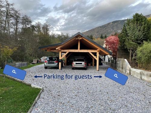 a parking lot with two cars parked in it at Koča Kopriva in Križe