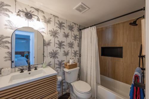 a bathroom with a sink and a toilet and a tub at Beach Block-1min Walk-Luxury-The Reef Downstairs in Ocean City