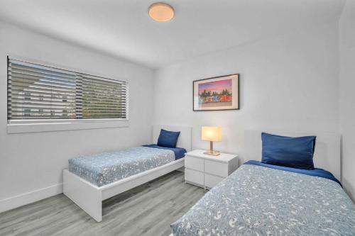 a bedroom with two beds and a window at West Brickell - #3 - Renovated 2 1 & Parking in Miami