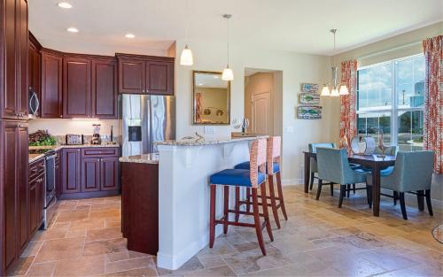 a kitchen with a bar and a dining room at Dolphins Vacation Rental in Merritt Island