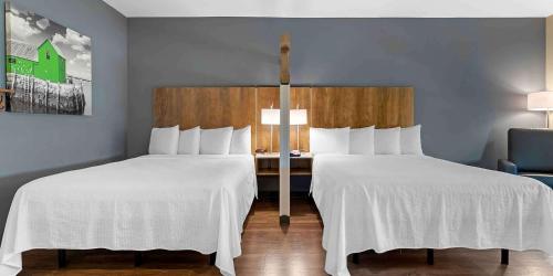 two beds sitting next to each other in a room at Extended Stay America Premier Suites - Savannah - Pooler in Savannah