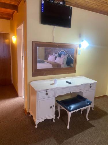 a room with a white desk with a mirror at Good Life Guest house in Orkney +27731671754 in Orkney