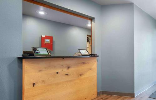 a room with two laptops on a wooden counter at Extended Stay America Select Suites - Mobile - Daphne in Daphne