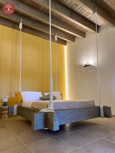 a bedroom with a swing bed in a room at I SECOLARI in Sannicandro di Bari