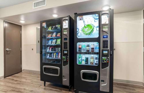 a large vending machine with drinks in a room at Extended Stay America Suites - New Orleans - Airport - I-10 in Kenner