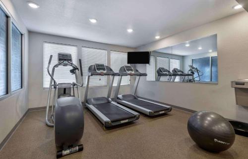 a gym with treadmills and ellipticals in a room at Extended Stay America Suites - Norco in Norco