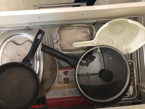 a pile of utensils sitting in a microwave at Residential 3 bed house Harnham in Salisbury