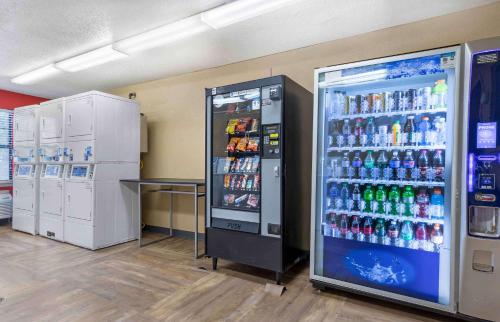 a large refrigerator filled with lots of soda bottles at Extended Stay America Select Suites - Greenville - Airport in Greenville
