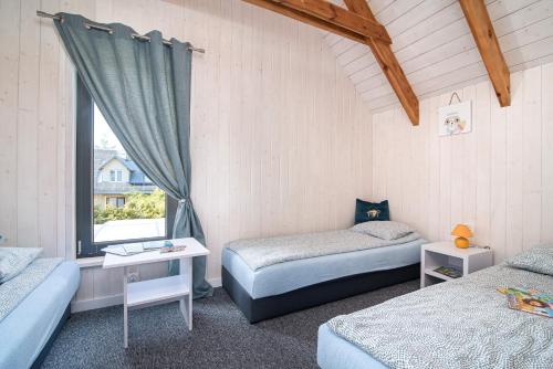 Ένα ή περισσότερα κρεβάτια σε δωμάτιο στο Fantazja&spa