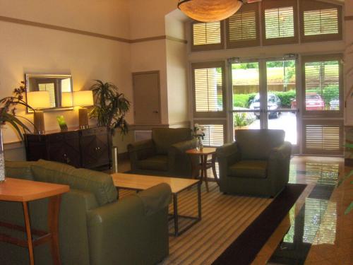 a living room with couches and chairs and a table at Extended Stay America - Atlanta - Marietta - Interstate N. Pkwy in Atlanta