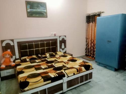 a large bed in a room with at Holistay - Homestay Jammu in Jammu
