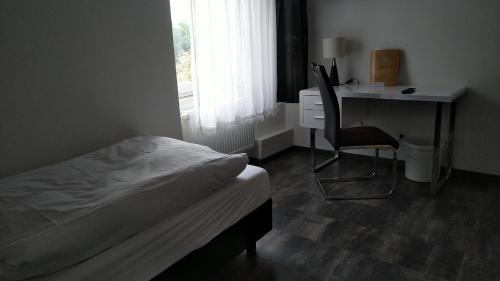 Ένα ή περισσότερα κρεβάτια σε δωμάτιο στο Hotel Zentrum