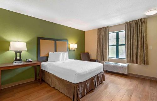 a hotel room with a bed and a window at Extended Stay America Suites - Atlanta - Perimeter - Crestline in Atlanta