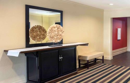 a room with a table and a mirror and a chair at Extended Stay America Suites - Philadelphia - Mt Laurel - Pacilli Place in Mount Laurel