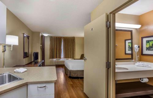 a hotel room with a bed and a bathroom at Extended Stay America Suites - Philadelphia - Horsham - Welsh Rd in Horsham