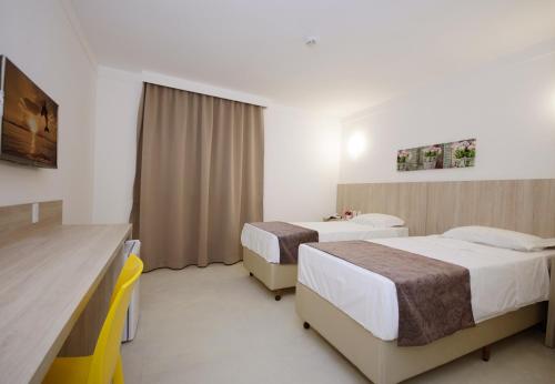 Postel nebo postele na pokoji v ubytování Pena Branca Hotel e Eventos