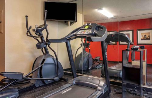 a gym with two exercise bikes and a flat screen tv at Extended Stay America Suites - Pittsburgh - West Mifflin in Willock
