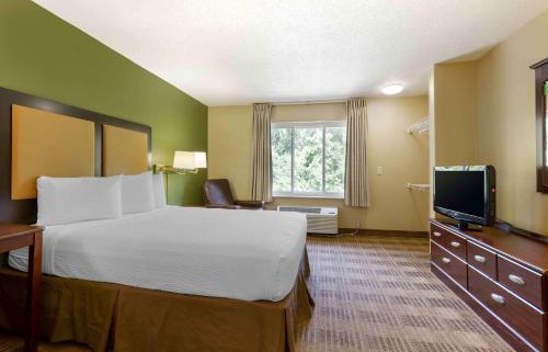 a hotel room with a bed and a television at Extended Stay America Suites - Washington, DC - Landover in Largo