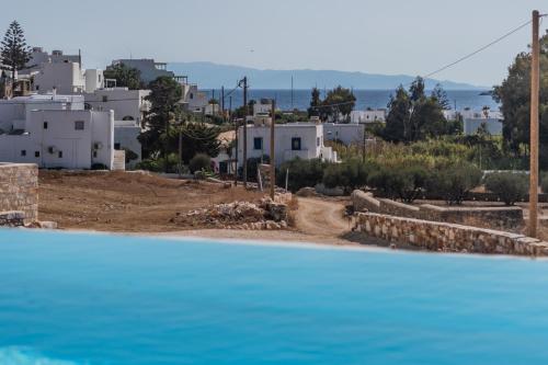 a view of a city from a swimming pool at Aegean Feelings in Piso Livadi